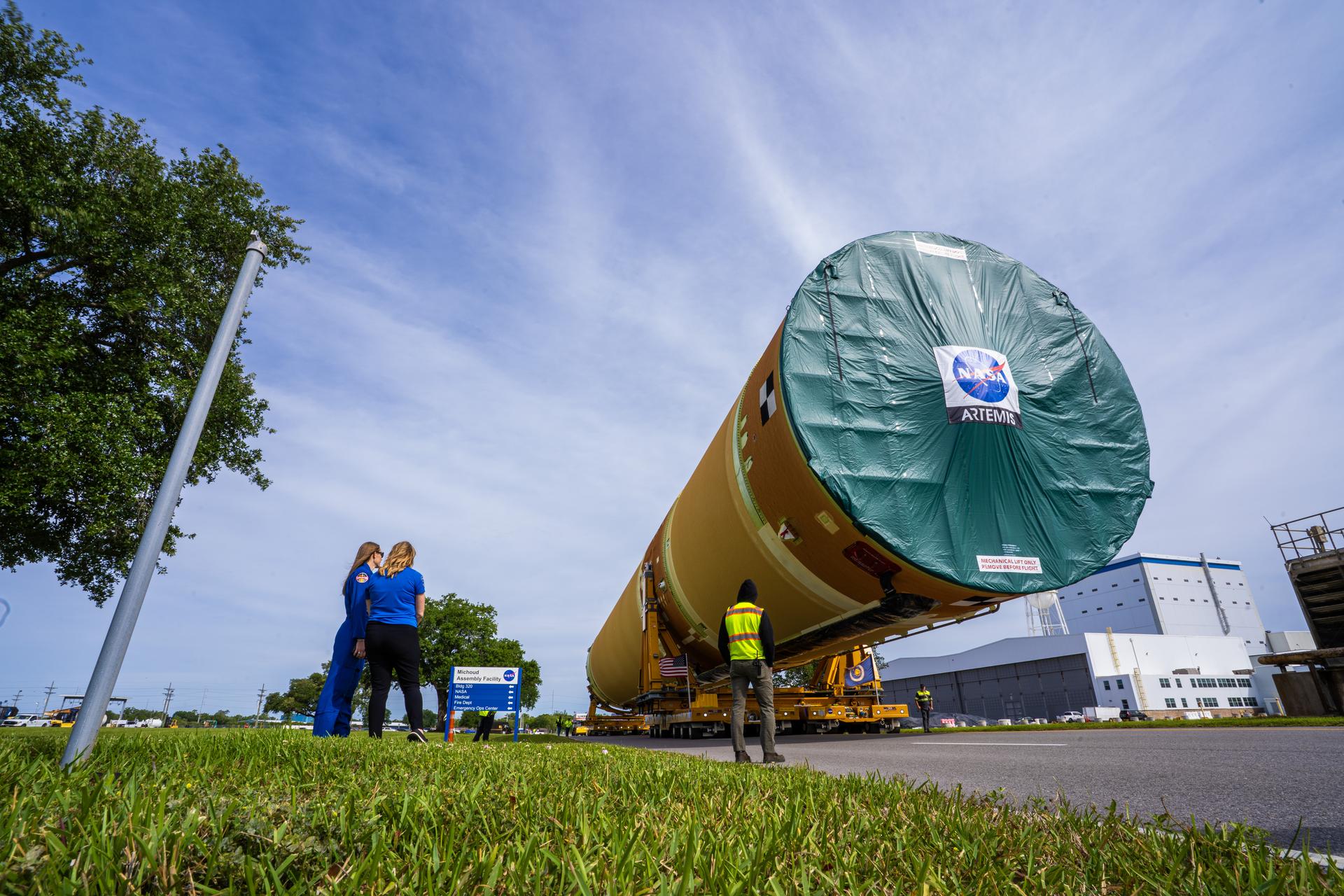 NASA moved the core stage, or the largest section, of the SLS (Space Launch System) rocket that will launch the crewed Artemis III mission in 2027 from the agency’s Michoud Assembly Facility to the agency’s Pegasus barge in New Orleans on April 20. The barge will ferry the top four-fifths – the section containing the liquid hydrogen tank, liquid oxygen tank, intertank, and forward skirt – of the SLS core stage to NASA’s Kennedy Space Center in Florida to complete outfitting and vertical integration.  Teams with NASA and Boeing, the SLS core stage lead contractor, used specialized transporters to guide the top four-fifths from the NASA rocket factory to Pegasus. Prior to the move, technicians added an engine section transportation simulator to the rocket stage for shipment to the Space Coast.  Next year’s Artemis III mission will launch astronauts to Earth’s orbit aboard the Orion spacecraft on top of SLS to test rendezvous and docking capabilities between Orion and commercial spacecraft needed to land Artemis IV astronauts on the Moon in 2028. NASA’s SLS is the only rocket capable of sending Orion, astronauts, and supplies to the Moon in a single launch.  